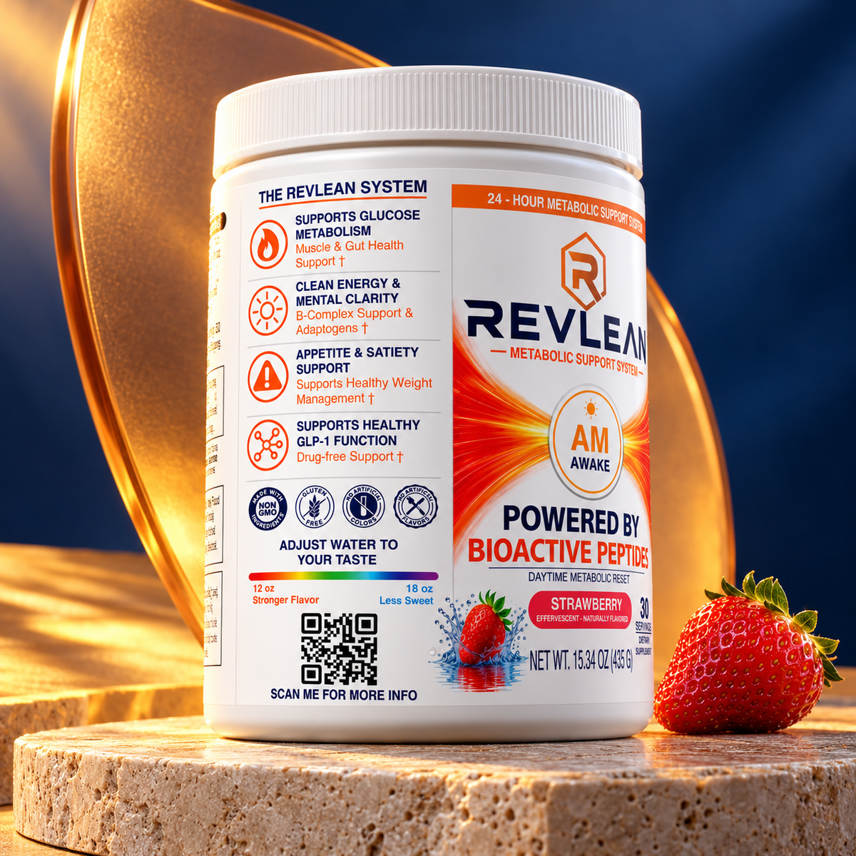 Revlean AM Awake strawberry tub beside a fresh strawberry on travertine, showing the side label and QR code